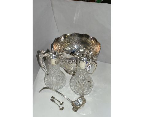 A GROUP OF SILVER PLATED ITEMS, to include a pair of cut glass plated claret jugs, a large punch bowl height 21cm x diameter 