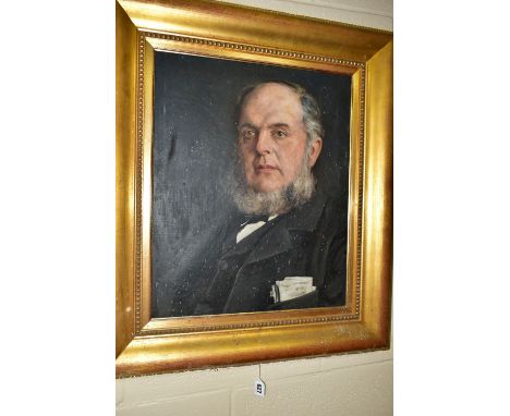A HEAD AND SHOULDERS PORTRAIT OF A VICTORIAN GENTLEMAN, he has a full beard but no moustache, he has some papers and a notebo