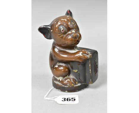 A FIRST HALF 20TH CENTURY PAINTED METAL BONZO MONEY BOX, the dog cast holding a briefcase, reg no.781602, height 13cm (Condit
