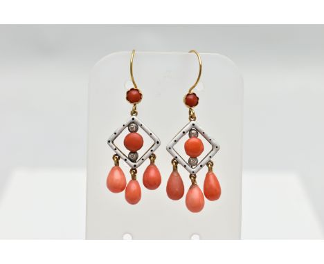 A PAIR OF ENAMEL, CORAL AND DIAMOND DROP EARRINGS, each earring is designed with a white enamel openwork diamond panel decora