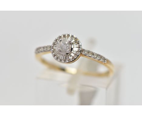 A 9CT YELLOW AND WHITE GOLD DIAMOND CLUSTER RING, set with a principal round brilliant cut diamond, within a baguette and tap