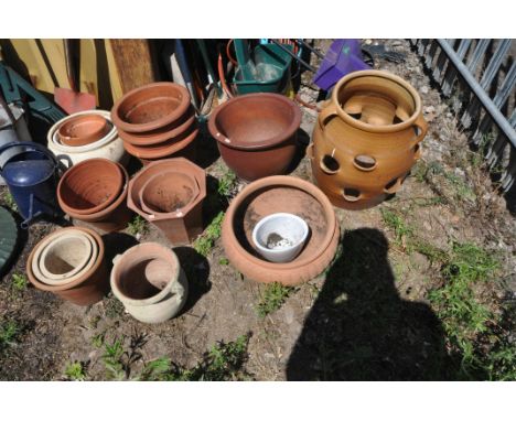 A SELECTION OF MOSTLY TERRACOTTA GARDEN PLANTERS, to include a strawberry/herb planter, a low campagna planter, a twin handle