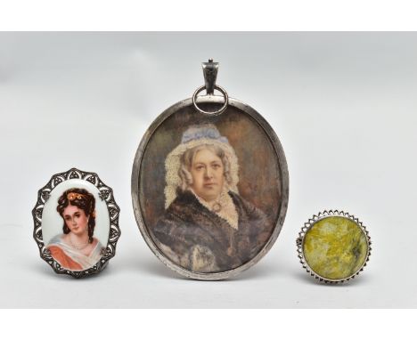 AN EARLY 20TH CENTURY SILVER MINIATURE PORTRAIT AND TWO BROOCHES, to include a large oval silver portrait frame, the portrait