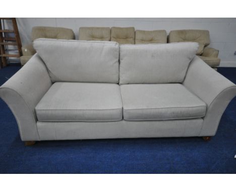 A CREAM UPHOLSTERED TWO SEATER SOFA, length 220cm