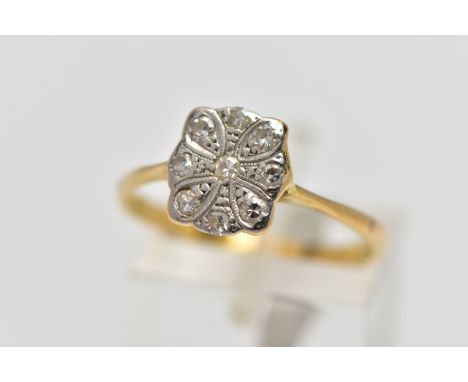 A YELLOW METAL DIAMOND DRESS RING, designed as a series of single cut diamonds set within a floral panel, estimated total dia