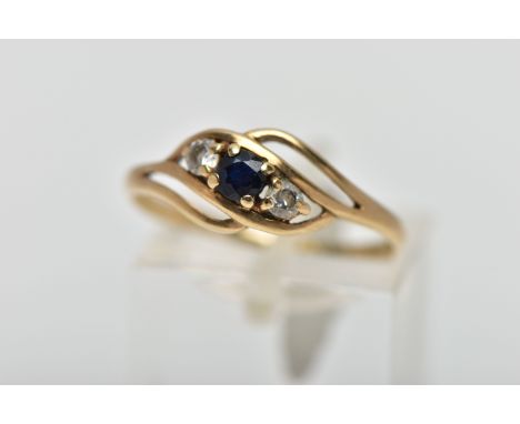 A 9CT GOLD GEM SET RING, asymmetrical design, centring on a four claw set, circular cut deep blue sapphire, flanked with four