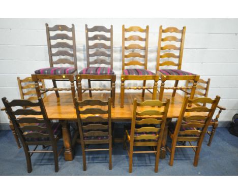 A REPRODUCTION OAK DRAW LEAF DINING TABLE, one additional leaf, along with a set of six ladder back chairs including two carv