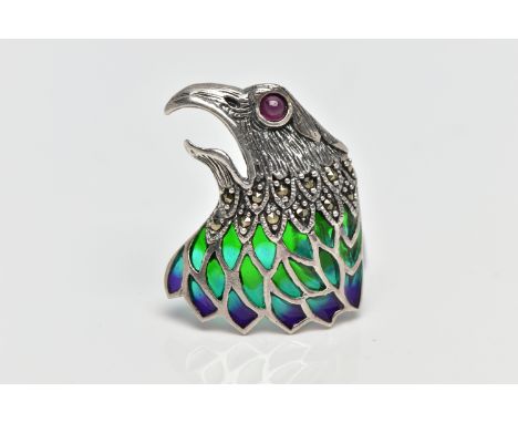 A WHITE METAL PLIQUE A JOUR, RUBY AND MARCASITE BIRD BROOCH, depicting a bird of prey's head and open beak, with circular rub