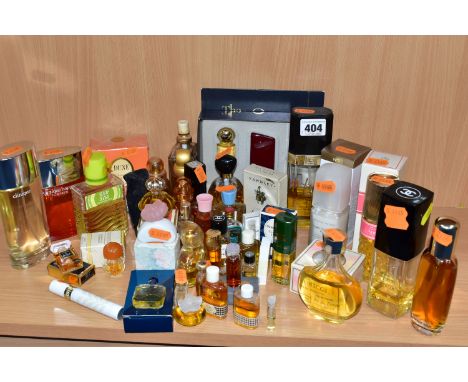 A GROUP OF PERFUMES AND PERFUME BOTTLES, to include Eau de Parfum and Eau de Toilette, a miniature Coco by Chanel, Fleur de F