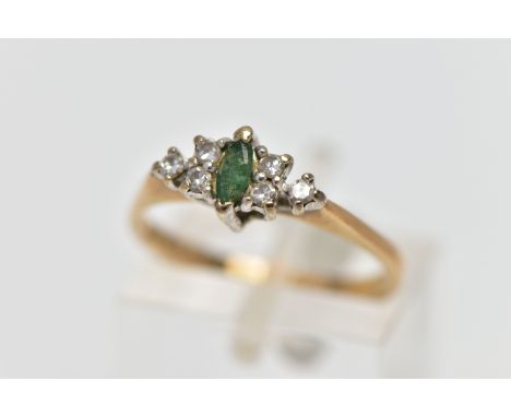 A 9CT GOLD EMERALD AND DIAMOND DRESS RING, the marquise cut emerald, with a trefoil of single cut diamond sides, to the taper