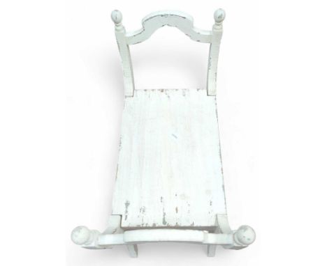 A distressed white painted bench with raised ends, 77cm high (max)