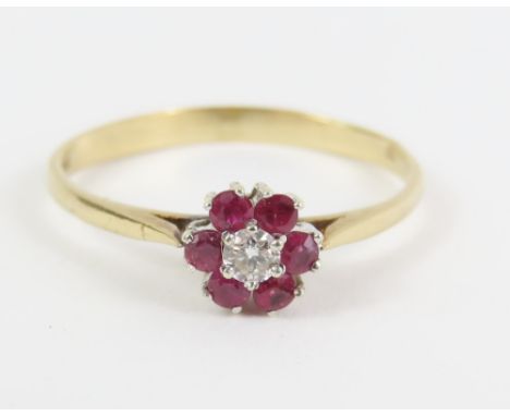 A 9ct gold ruby and diamond cluster ring, finger size P 1/2, 1.4g gross, cased