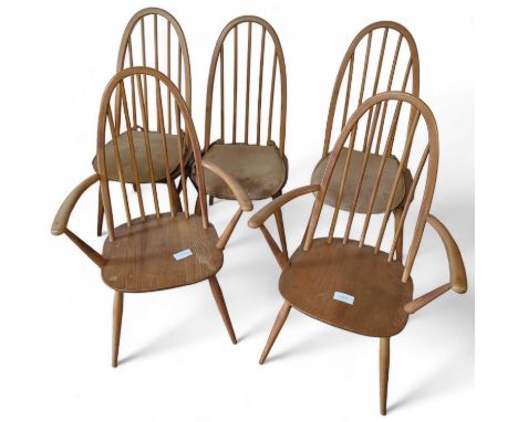 A set of Six (two carvers and four chairs) Ercol Windsor dining chairs, some with black and gold stickers