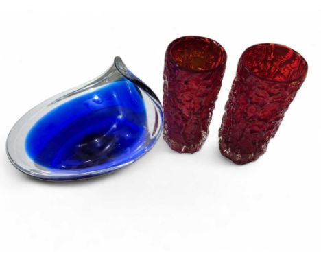 A pair of Whitefriars textured bark vases, ruby colour, 19cms high together with a heavy blue and clear glass bowl (3) 