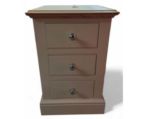 A three drawer bedside cabinet, with light oak top, and chrome handles, 67cm high, 43cm wide, 43cm deep