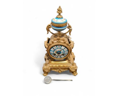 A French gilt metal and painted porcelain mantel clock striking on a bell, 32cms high