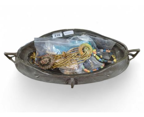 An Art Nouveau oval pewter WMF mounted pointed fruit bowl, 49cms wide together with bead necklaces and other costume jeweller