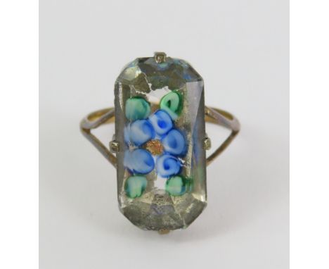 A vintage ring, set with a lozenge shaped plastic decorated with flowers, marked '9ct sil', finger size K 1/2, cased