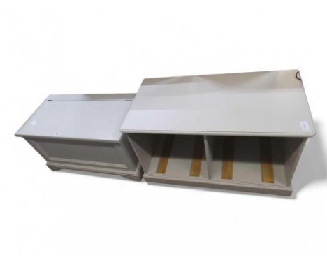 A light grey ottoman, with hinged lid and panel front, 94cm long, 52cm high, 49.5cm deep; together with a storage unit in the