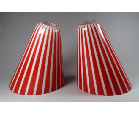 A pair of vintage glass lamp shades - red and white striped and of truncated conical form, height 17cm. (2)