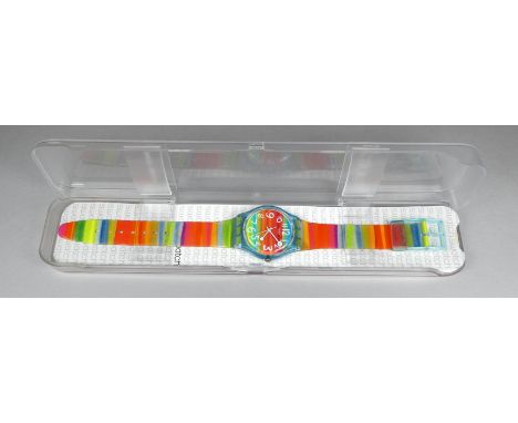 A child's Swatch watch - with rainbow colourway, with case and paperwork. 