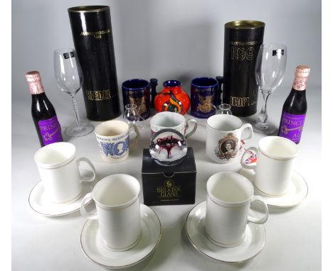 A Elizabeth II silver jubilee mug - together with other commemorative mugs, a Poole Pottery vase and two bottles of commemora