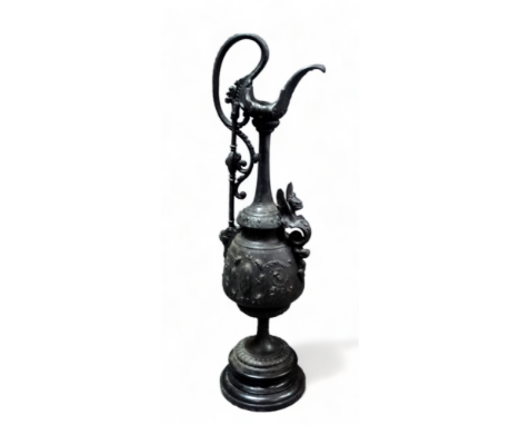 After the antique, a cast metal ewer - decorated with flowers and masks on a socle base, height 60cm, together with a pair of
