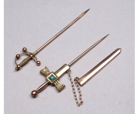 A 9ct gold stock pin modelled as a sword - together with another with scabbard and set with pearls and gemstone, weight 2.7g.