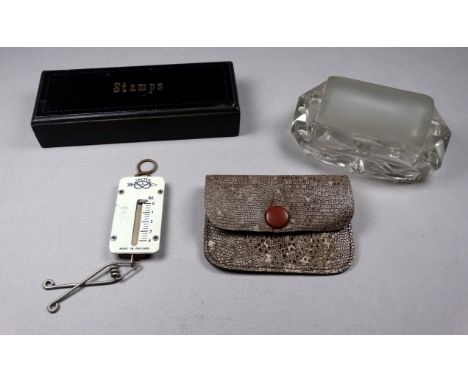 A 19th century clear glass stamp roller - width 9cm, together with a set of pocket stamp scales and an ebonised stamp box. (3