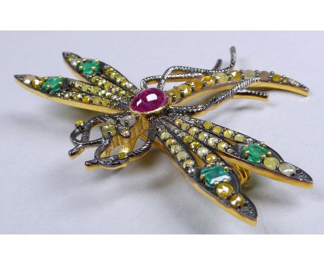 A dragonfly brooch set with a cabochon ruby, emeralds and diamonds - the ruby weighing 2.01ct approximately, the emeralds wei