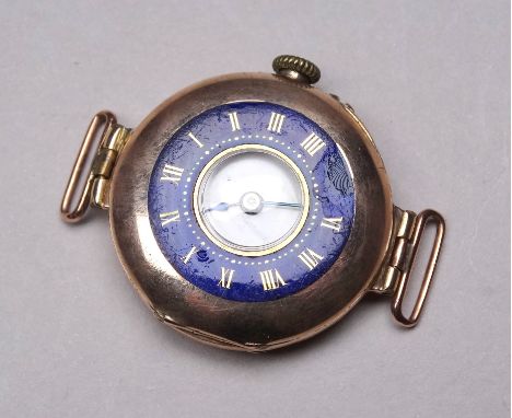 An early 20th century 9ct gold cased wristwatch - with a white enamel chapter ring set out in Roman numerals, with outer case