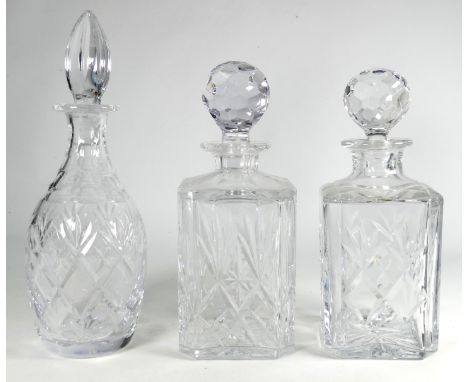 A pair of 20th century cut glass decanters - square with chamfered corners, height 24cm, together with another cut glass deca