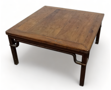 A late 19th century Chinese oriental hardwood low table - the square panelled top above cluster column legs, with wax export 