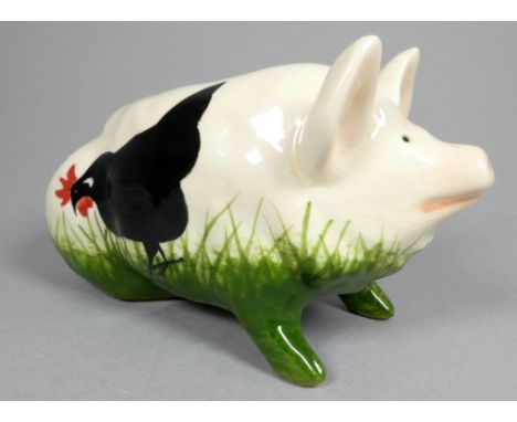 A Wemyss Griselda Hill pottery pig - seated, decorated with black chickens, width 18cm.