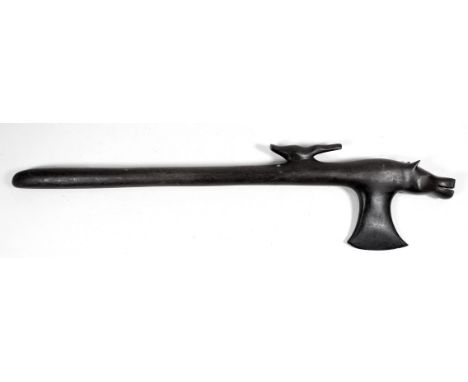 A ceremonial hardwood axe - the head modelled as a hippopotamus with a bird on its back, length 51cm.