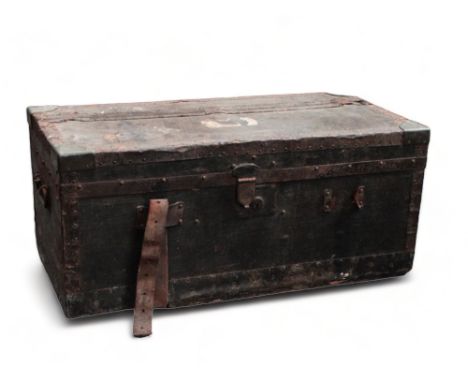 An early 20th century car trunk - covered in black oilcloth with steel banding and brass corners, the interior finished in a 