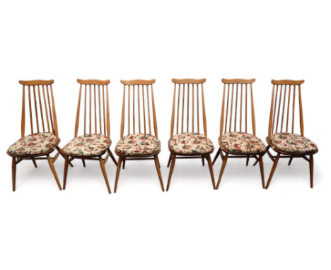 A set of six Ercol Goldsmith dining chairs - model 369, bearing labels to the seat, on turned legs joined by an H-shaped stre