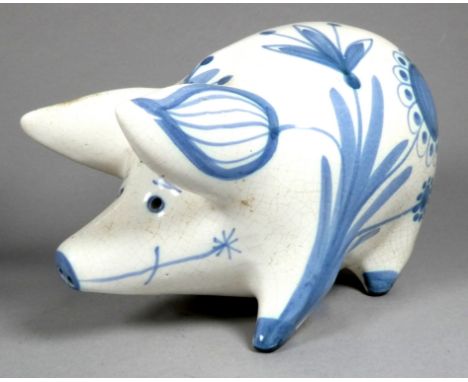 A Rye Pottery pig - by David Sharp, decorated with blue foliage and flowers, width 19cm, together with another in brown glaze