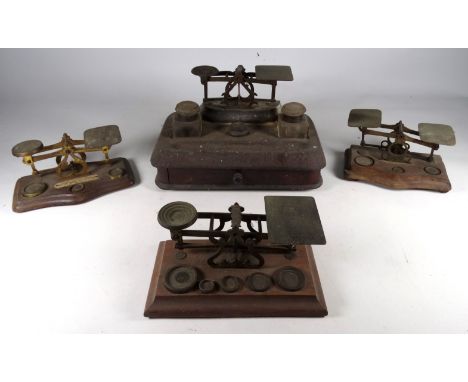 An early 20th century mahogany standish - incorporating a pair of glass inkwells, a drawer and a set of postal scales, width 