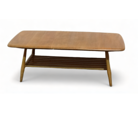 An Ercol elm and beech coffee table - model 459, of rectangular form with a slatted undertier and turned splayed legs, 107 x 