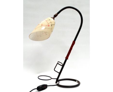 After Jacques Adnet (1900-1984) a snake desk lamp - wrought steel with a tan leather band, fitted with a Vianne vintage glass
