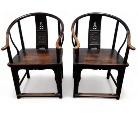 A pair of 19th century Chinese oriental hardwood horseshoe back chairs - with pierced and carved contoured splats above a pan