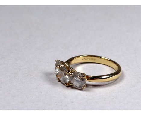 An 18ct yellow gold diamond three stone ring - the circular brilliant cut diamonds weighing 2.34ct, size M, weight 4.2g, toge