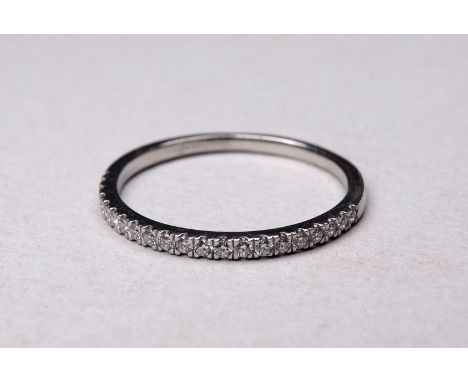 A platinum diamond half hoop eternity ring - claw set, size S/T, weight 2.7g.