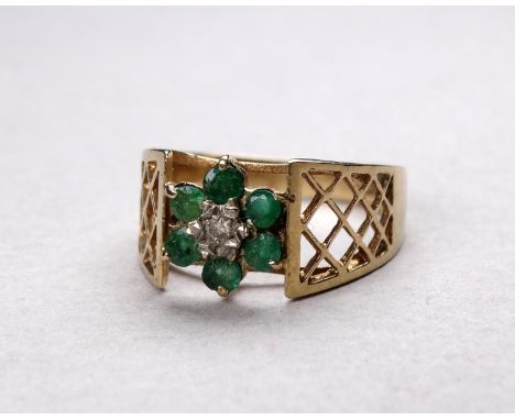 A 9ct gold emerald and diamond set ring - of foliate design with pierced shoulders, size J, weight 2.9g.