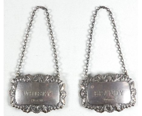 A pair of silver decanter labels - Sheffield 1980, Francis Howard Ltd, rectangular with a foliate border, one marked 'Brandy'