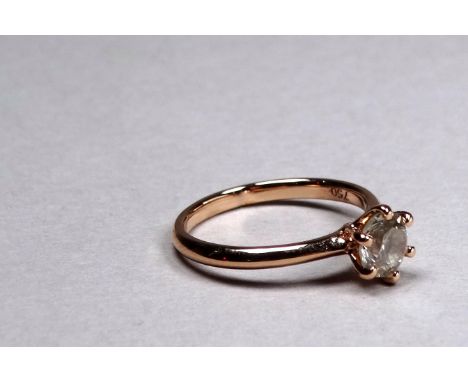 An 18ct rose gold diamond solitaire ring - the brilliant cut diamond weighing 0.91ct approximately, size L/M, weight 2.8g, to