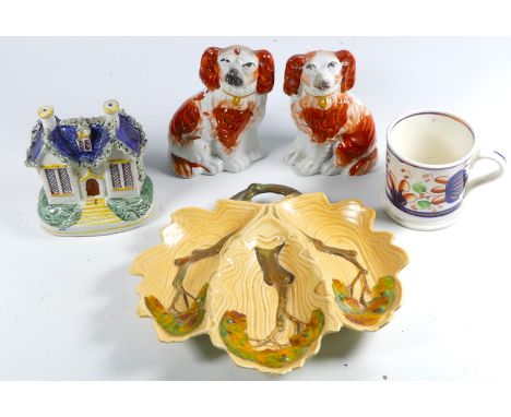 A 19th century Staffordshire money box - in the form of a cottage, height 12cm, together with a pair of Staffordshire dogs, a
