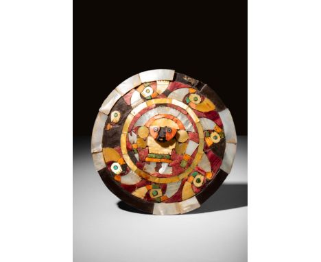 Ca. AD 800 - 1100 A Pre-colombian discoid wooden earring embellished with a circular decoration depicting a register of styli