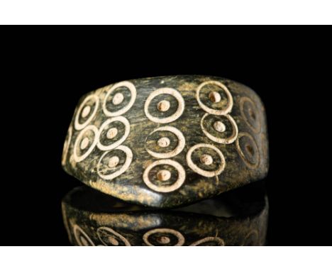 Ca. AD 400 - 800 A beautiful Byzantine bronze archer ring adorned with a pattern of circles and dots on the external surface.